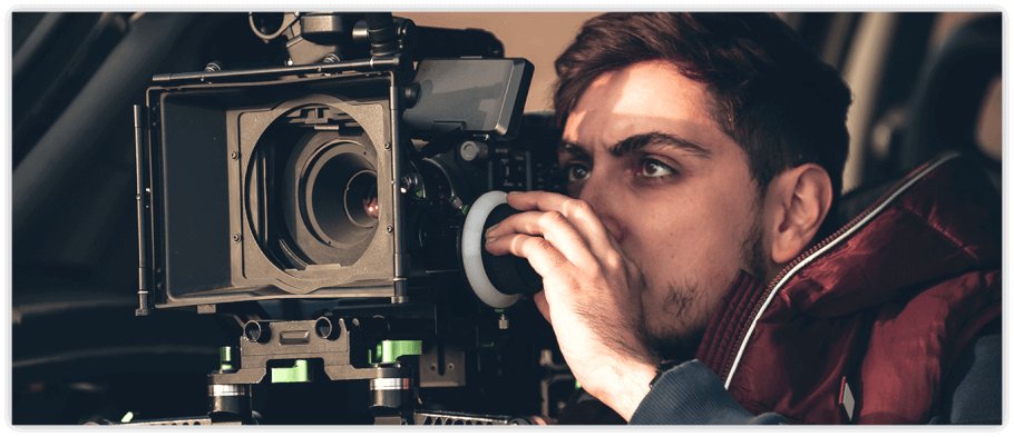 Director looking through camera lens