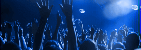 Photo Of People's Arms At A Concert