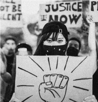 Photo Of Asian Woman Holding A Protesting Sign