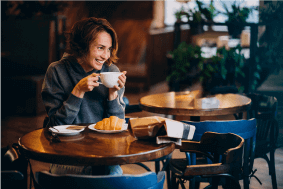 Woman Sitting In Cafe Photo